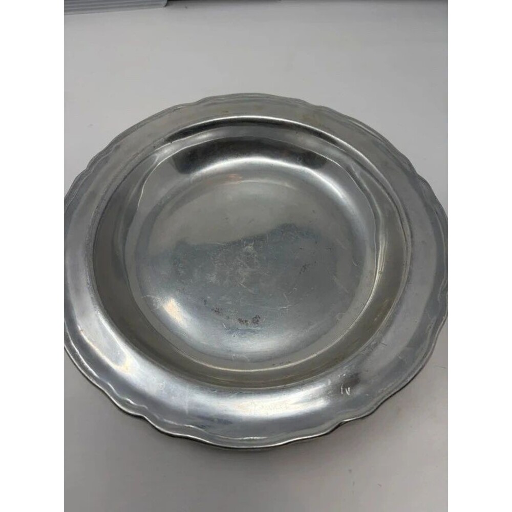Vintage pewter serving bowl with wear